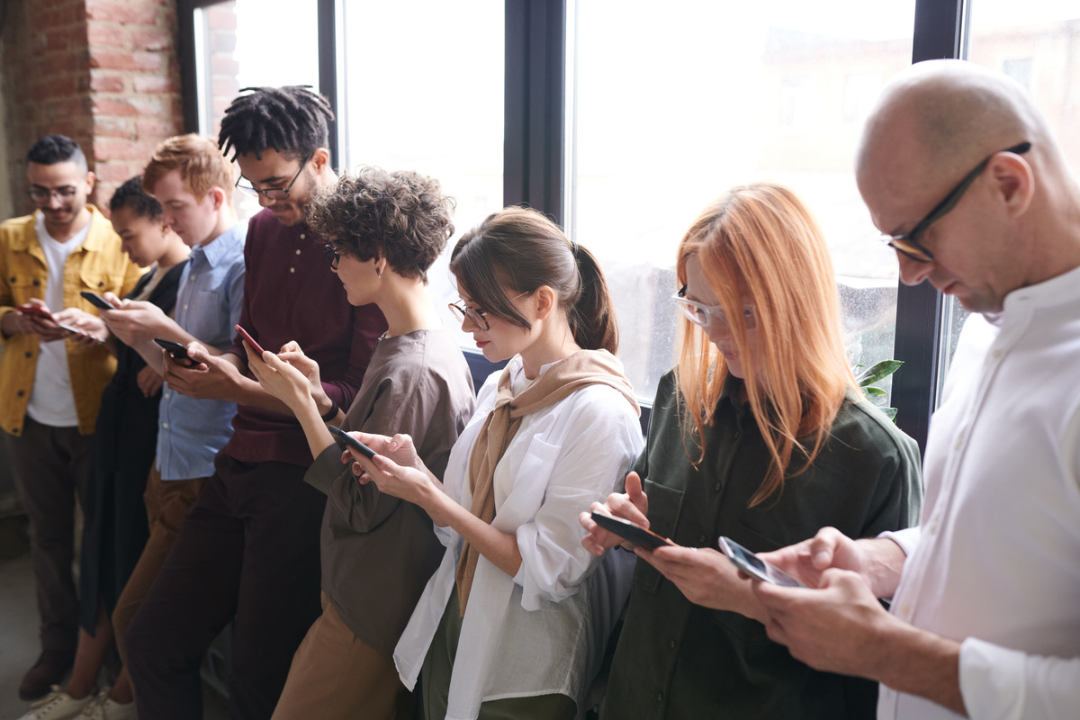 Photo Of People Using Smartphones